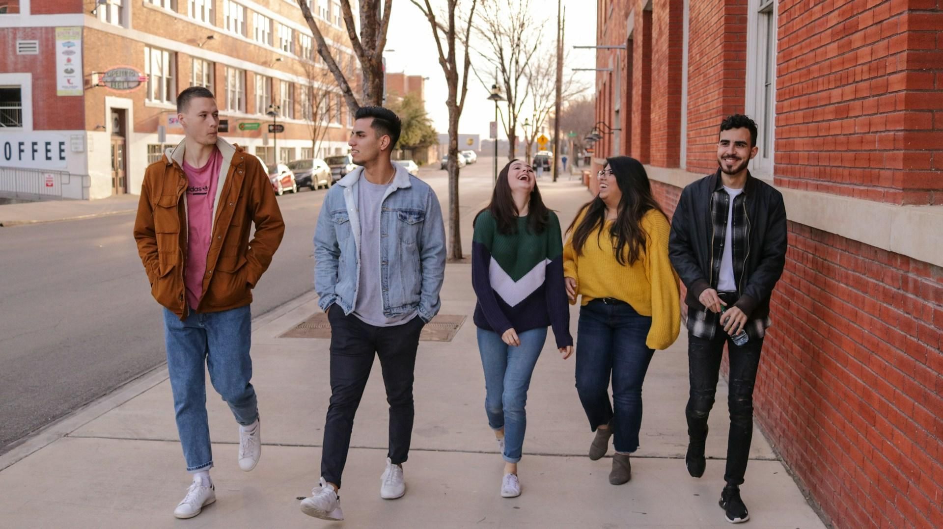 Group of college students walking together through a city street, representing the freshman-to-senior internship timeline