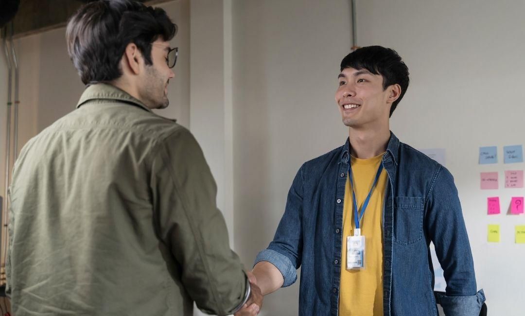 Intern-shaking-hands-with-colleague-zapply