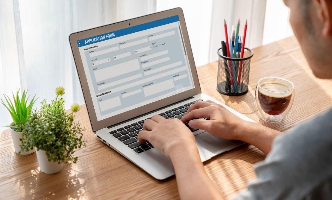 Man-filling-out-online-application